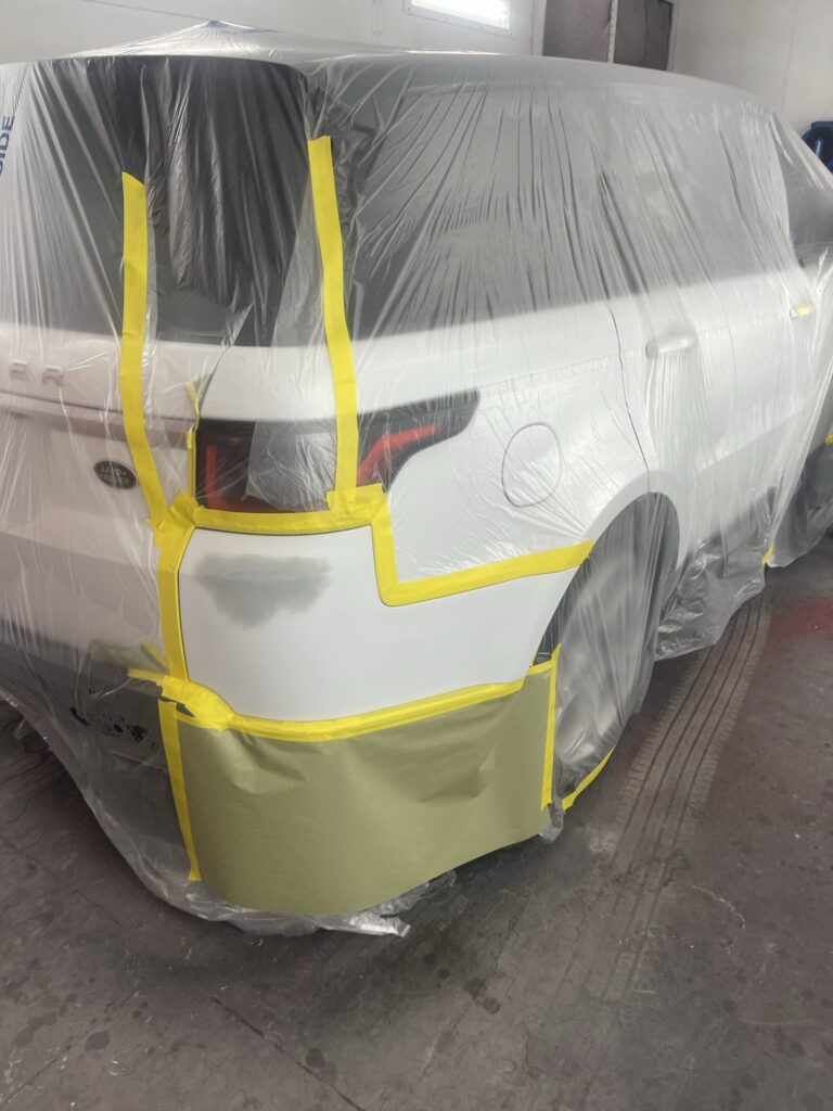 Vehicle being prepared for paint in our shop